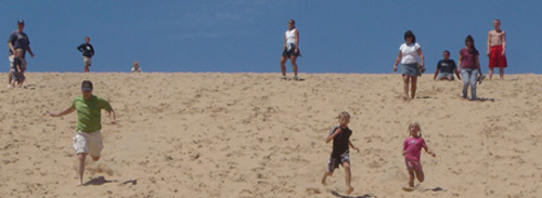 running down Sleeping Bear dunes with cousins